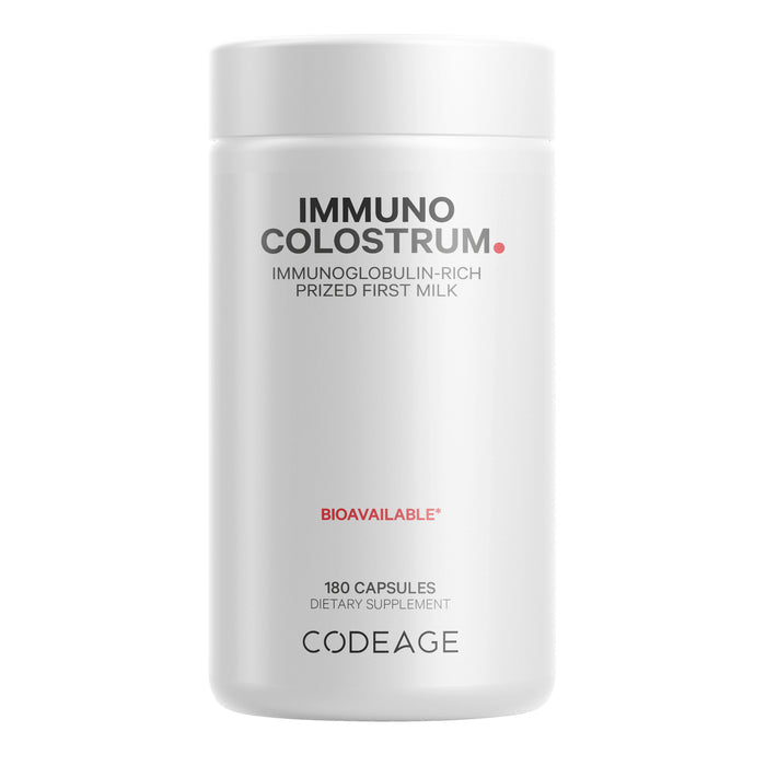 The Immuno Colostrum bottle from Codeage, in white, displays 180 Capsules Dietary Supplement. In red text are the phrases Immunoglobulin-Rich Prized First Milk and Bioavailable. This colostrum supplement supports the immune system and is sourced from grass-fed bovine.