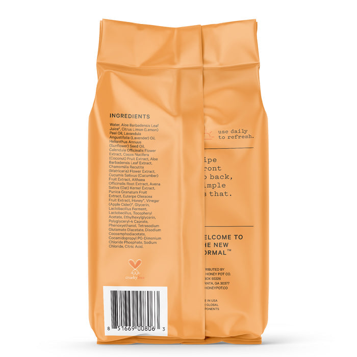 The back of The Honeypot Companys Intimate Wipes - Normal package, in peach color, lists ingredients like water and aloe barbadensis leaf juice. It includes a gynecologist-approved new normal icon at the bottom, emphasizing optimal vaginal pH balance for feminine cleansing.