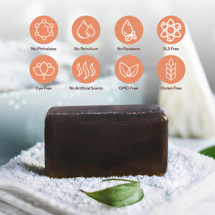 Marie Originals Itch Relief Soap sits on white powder with a green leaf, shown with icons for no phthalates, petroleum, parabens, SLS, dyes, artificial scents, GMOs, or gluten—ideal for sensitive skin cleansing.