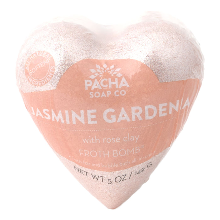 A heart-shaped Jasmine Gardenia Froth Bomb by Pacha Soap Co., comes in pink packaging, weighs 5 oz (142 g), and promises a spa-like experience with rose clay. It highlights natural ingredients and softening properties.