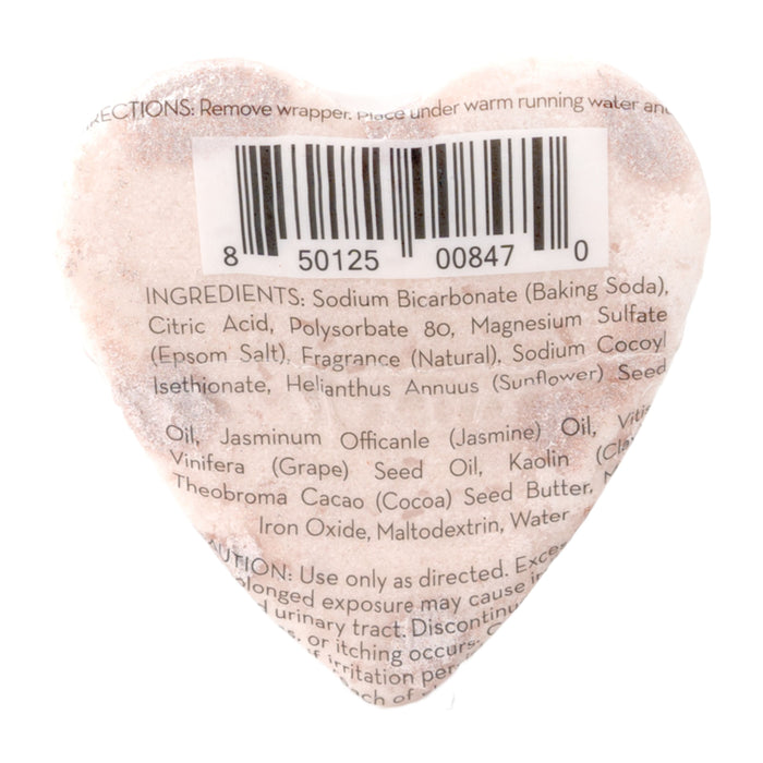 The Jasmine Gardenia Froth Bomb by Pacha Soap Co. offers a spa-like experience with rose clay in a heart-shaped design. Ingredients include sodium bicarbonate, citric acid, Epsom salt, fragrance, and various oils. The label features a barcode at the top center with small, slightly curved text.
