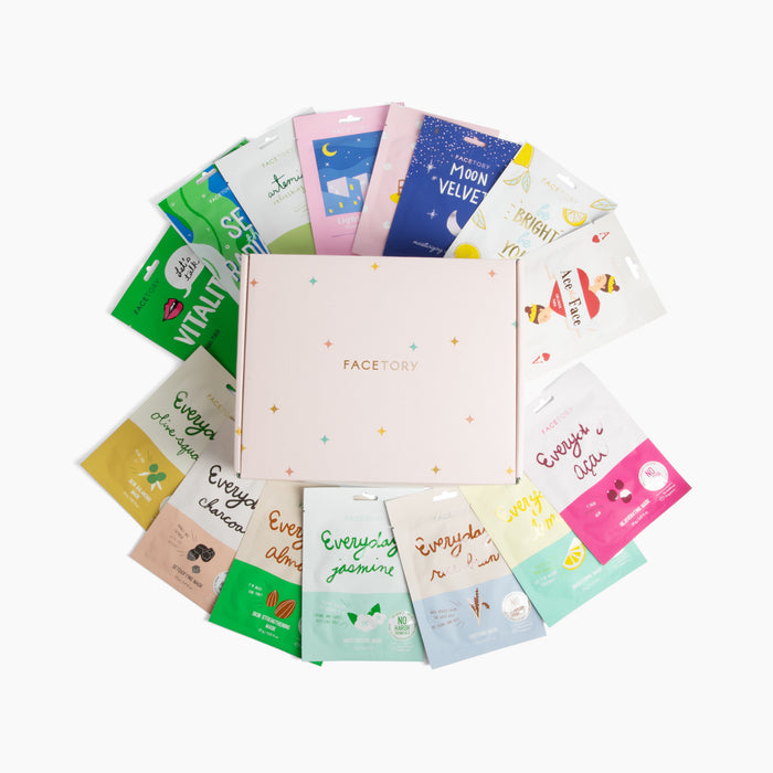 A circular display of colorful packaging showcases the K Beauty Face Mask Set by FaceTory. Each pack, uniquely branded and designed, highlights its concentrated essence—a self-care essential against a plain white background.