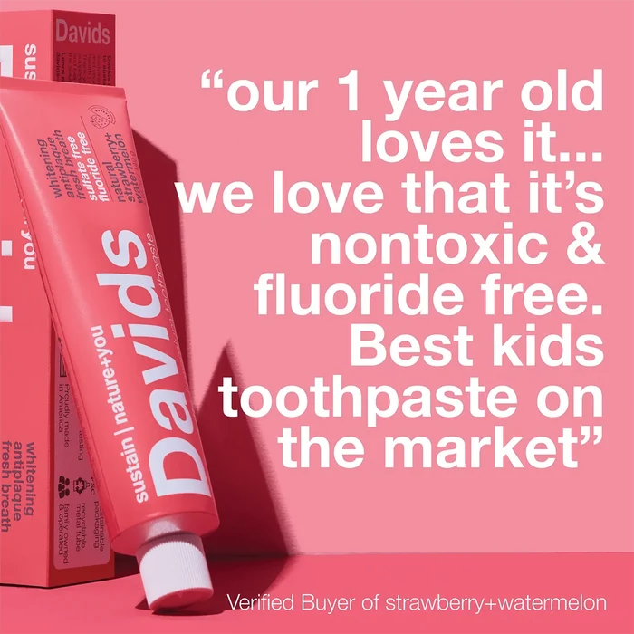 A pink tube of Davids Kids + Adults Premium Toothpaste is pictured next to a review stating it’s nontoxic, fluoride free toothpaste, and loved by a 1-year-old. The review calls it the best kids toothpaste for both kids and adults.