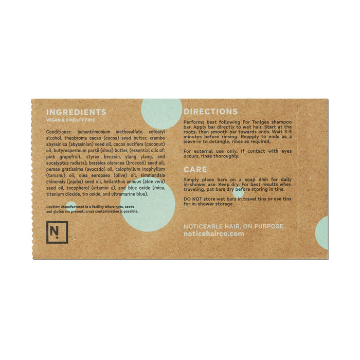 The For Tangles Conditioner Bar by NOT!CE Hair Co comes in brown paper packaging, detailing its vegan and cruelty-free ingredients along with directions. Its ultra-detangling formula offers plastic-free hair care. Care instructions and a website link are included at the bottom.