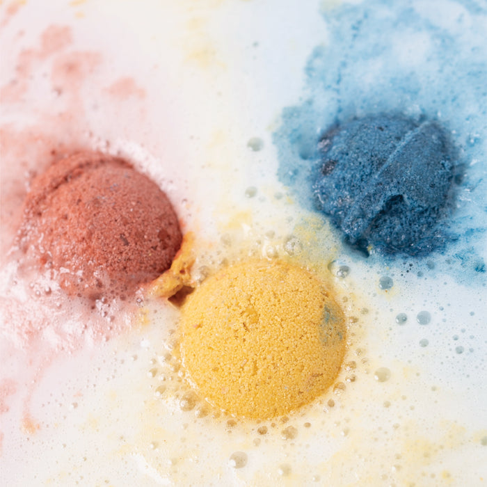 The Pacha Soap Co. Kids Froth Bomb Set includes three colorful bath bombs that fizz to create marbled swirls and bubbles. Kid safe and non-toxic, these make bath time worry-free and fun.
