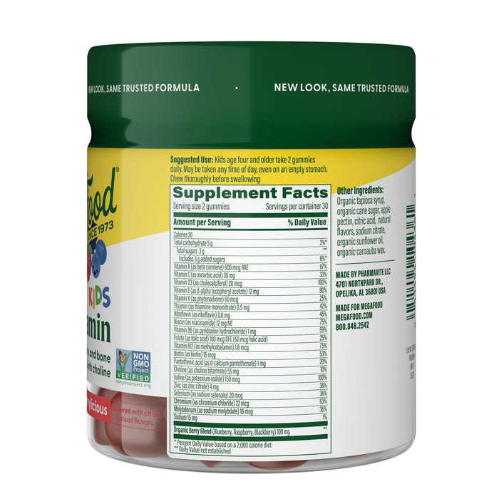 A close-up of the back label of MegaFood Kids Multi Gummies shows supplement facts, suggested use, manufacturer details, Non-GMO label, and ingredient list for this kids multivitamin.
