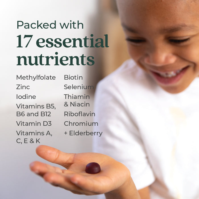 A child smiles, holding a gummy. Text beside them reads: New Chapter Kid’s Multivitamin Gummies—Berry Citrus Flavored, nutrient packed with 17 essentials, less sugar, plus immune support vitamins and elderberry for kids.