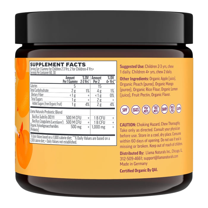 A jar of Llama Naturals Kids Real Fruit Pre & Probiotic Gummies with an orange label stands proudly, infused with plant-based prebiotic fiber. The Supplement Facts panel is visible, detailing ingredients and nutritional information. Icons indicate it is soy, egg, nut, dairy, fish, and shellfish free.