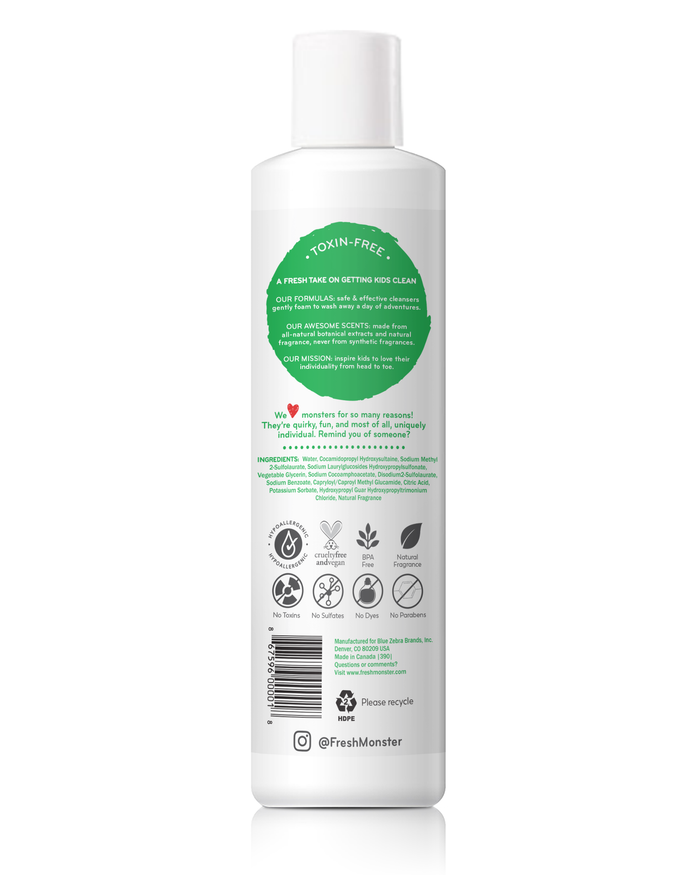 A white bottle features a green circular label with details on the toxin-free ethos and ingredients of Fresh Monsters hypoallergenic Kids Shampoo & Conditioner 2in1. Eco-friendly certifications are displayed through icons. Follow @FreshMonster for more updates.