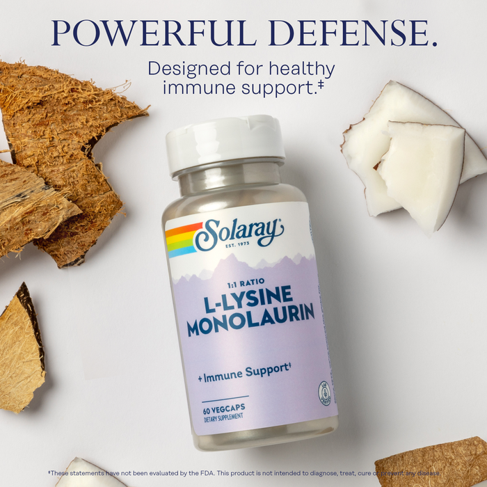 A bottle of Solaray L-Lysine Monolaurin supplement is placed on a surface surrounded by coconut pieces. The label highlights its immune support benefits. The text above reads "Powerful Defense. Designed for healthy immune support.