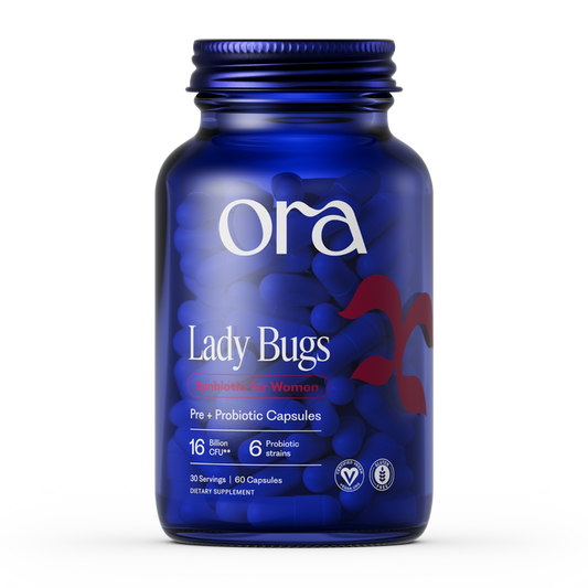 A blue Ora Organic Lady Bugs: Synbiotic for Women bottle has 60 capsules with 16 billion CFU and 6 probiotic strains to support vaginal health, plus several certification icons at the bottom of the label.