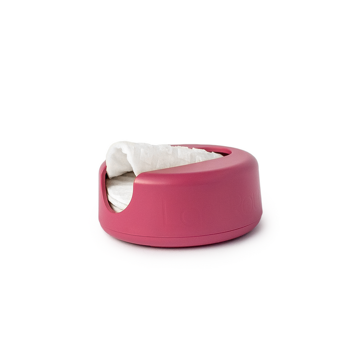 The LastRound by LastObject is a pink pet bed featuring an eco-friendly design, with a soft white blanket partially covering its interior. It showcases a rounded outer rim and includes a concave entrance on one side.