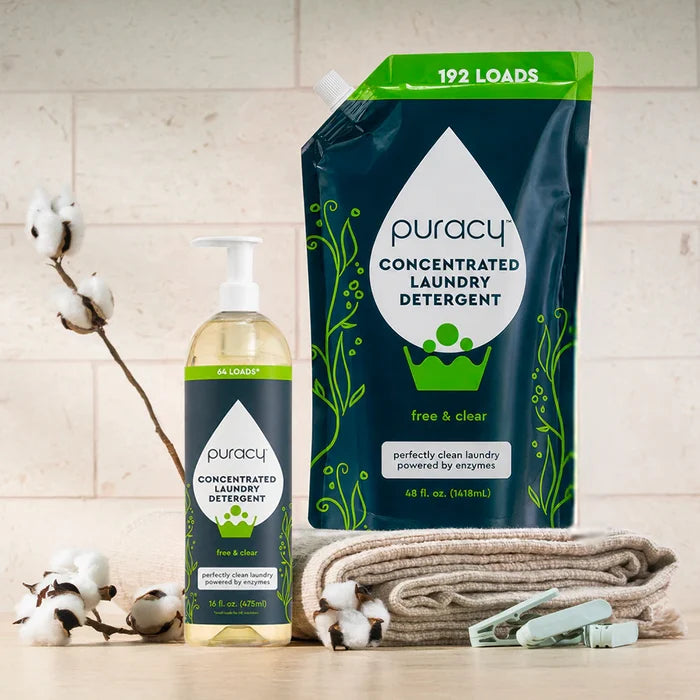 Laundry Detergent (Concentrated, Sulfate-Free) with folded towels and a cotton branch on the counter.