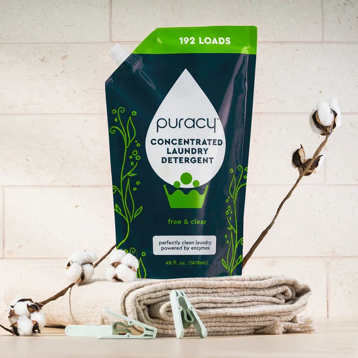 A Laundry Detergent (Concentrated, Sulfate-Free) pouch on towels, with stain-fighting enzymes.