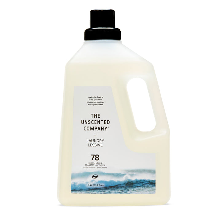 A large white bottle of The Unscented Company Laundry Detergent with a black cap, ocean wave image, and "78 loads" text. This hypoallergenic formula is fragrance-free and dye-free.