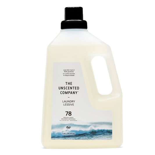 A large white bottle of The Unscented Company Laundry Detergent with a black cap, ocean wave image, and "78 loads" text. This hypoallergenic formula is fragrance-free and dye-free.