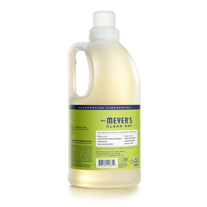 A bottle of Mrs. Meyers Laundry Detergent features a hardworking, cruelty-free formula, emphasizing natural ingredients and essential oils. The light yellow bottle includes a convenient spout for easy pouring.