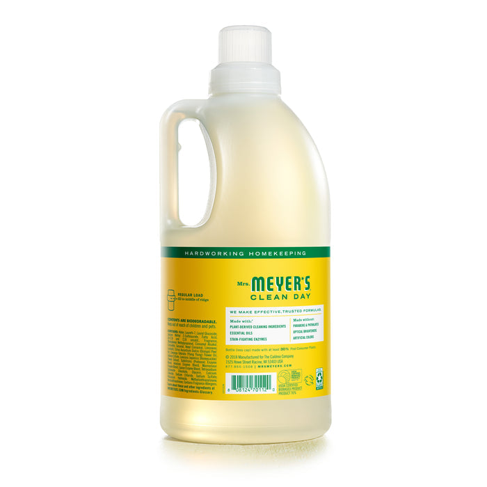 A bottle of Mrs. Meyers dish soap features a yellow label with green text, a handle, and a white cap. It pairs well with Mrs. Meyers Laundry Detergent for effective housekeeping tasks.