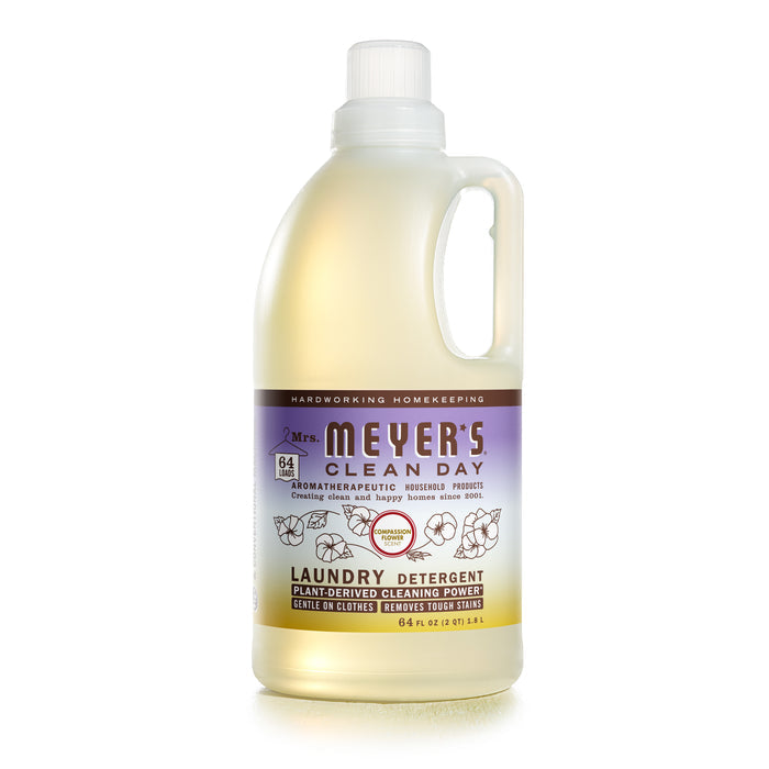 Mrs. Meyers laundry detergent, 64 fl oz, comes in a translucent bottle with a purple and white label and white cap. It features a cruelty-free, lavender-scented formula with plant-derived cleaning power and essential oils for gentle care on clothes.