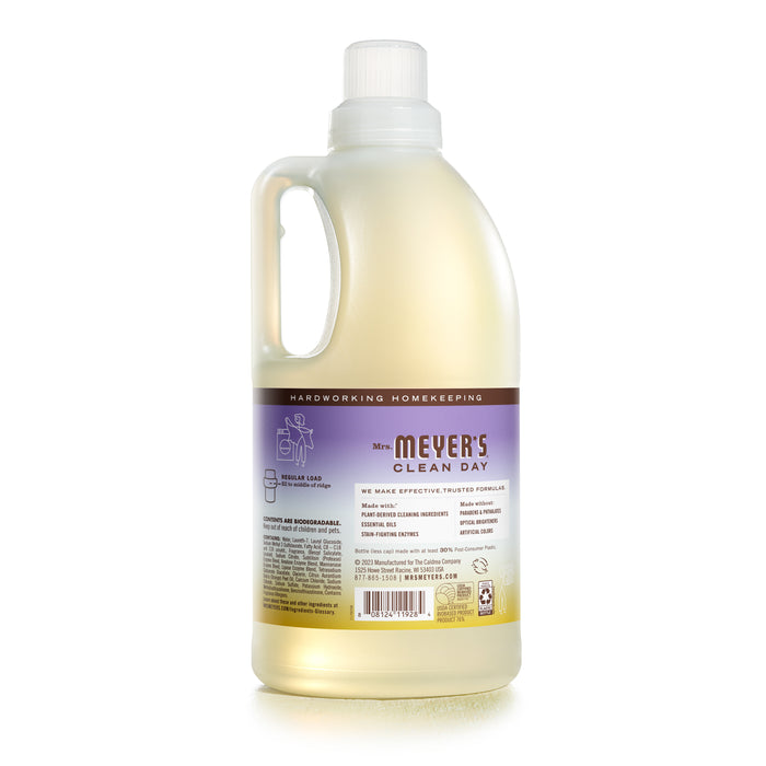 A lavender-labeled plastic bottle of Mrs. Meyers Laundry Detergent, featuring a side handle, emphasizes its strong cleaning power and eco-friendly formula.