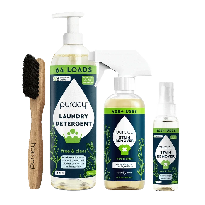 Explore the Laundry Essentials Bundle, which includes a wooden brush, laundry detergent, and stain removers set against a green background. Enhance your laundry routine and combat stubborn stains with our eco-friendly solution.
