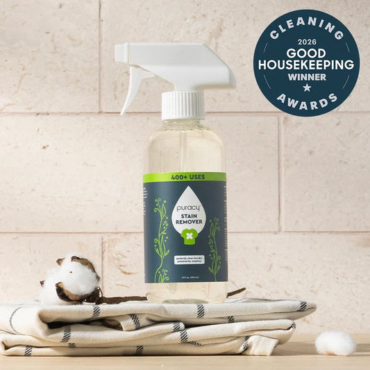 Laundry Stain Remover spray on cotton towels, featuring a 2026 Good Housekeeping award badge.