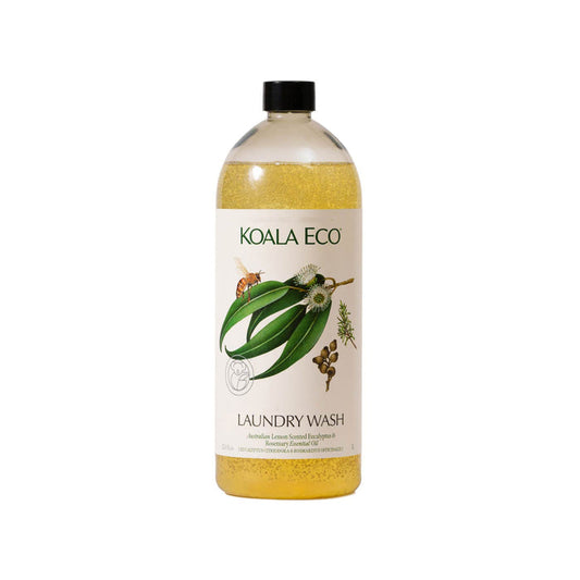 A clear bottle of Koala Eco Laundry Wash – Lemon-Scented Eucalyptus & Rosemary, with yellow liquid, a black cap, and a white label featuring eucalyptus leaves and flowers. Made in Australia.