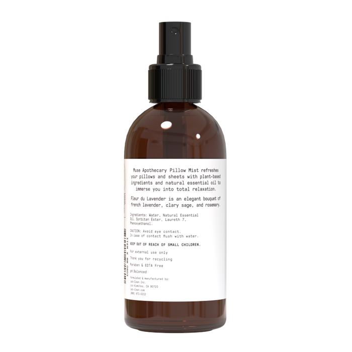 A brown spray bottle with a black nozzle labeled Muse Apothecary Linen, Pillow and Fabric Spray offers a calming mist made with natural ingredients and an aromatic blend of lavender, clary sage, and rosemary essential oils for soothing aromatherapy bliss.