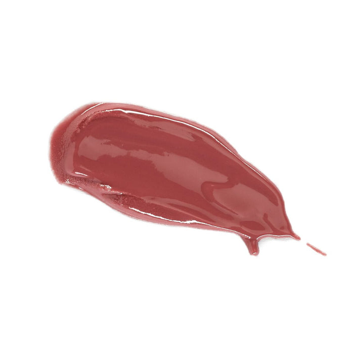 A smear of Lily Lolos Lip Gloss in glossy red-brown, with a smooth texture and shiny finish, is set against a plain white background. It perfectly captures the essence of natural beauty products.