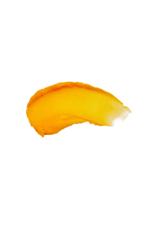 A vibrant orange mango slice on a plain white background embodies the essence of organic elements, with its smooth curve and juicy look mirroring the nurturing quality of Henné Organics Lip Mask.