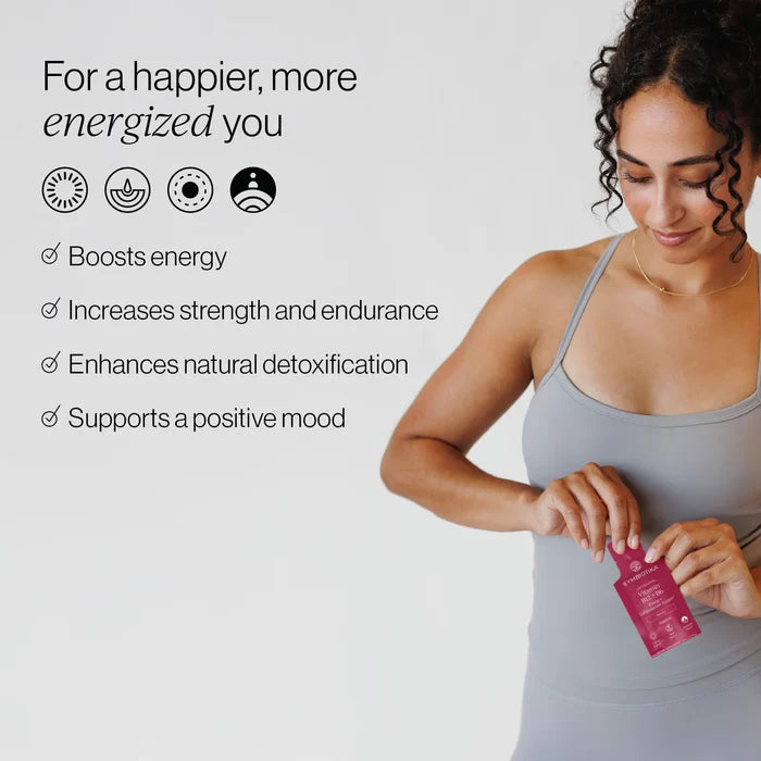 A woman in athletic wear opens a packet of Cymbiotika Liposomal Vitamin B12 + B6. Text lists benefits: boosts energy, increases strength and endurance, enhances detoxification, supports a positive mood with bioavailable folate and vitamin B6. “For a happier, more energized you” appears at the top.