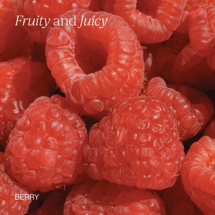 A close-up photo of fresh, ripe raspberries with a juicy texture. The words “Fruity and Juicy” appear at the top left, while “Liposomal Vitamin B12 + B6 by Cymbiotika” is written at the bottom left, highlighting the natural vibrancy that supports cognitive health with active B vitamins.