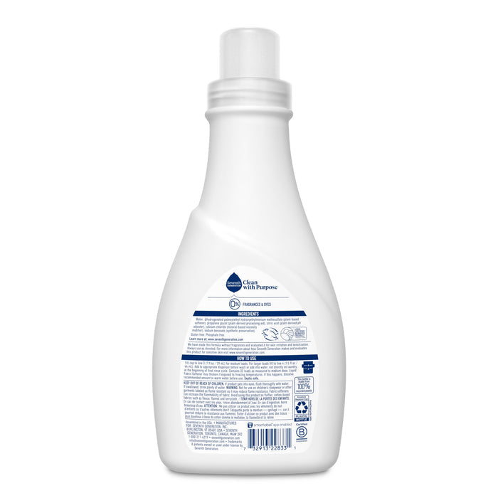 A white bottle of Seventh Generation Liquid Fabric Softener is shown from the back, featuring a blue and white label with text, usage instructions, and symbols; the brand and product name are not visible from this angle.