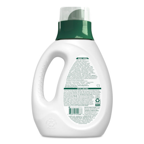 A white plastic Seventh Generation Liquid Laundry Detergent bottle with a green cap is shown from the back, displaying a label with instructions, barcode, 2x Concentrate info, and a built-in handle on the left side.