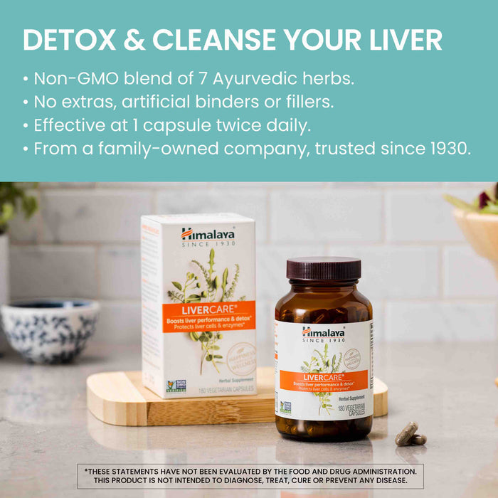Image of a bottle and box of Himalaya LiverCare supplements on a wooden counter. The bottle contains dietary capsules for liver support. Behind the supplements are a patterned bowl and some plants. Text highlights the product's benefits and company's background.