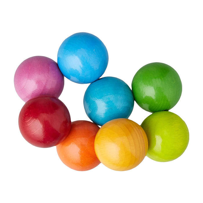 The HABA Magica Wooden Clutching Toy is a delightful set of eight vibrant wooden balls in colors like blue and green. These glossy spheres overlap playfully, offering a non-toxic, sustainable toy option for babies.
