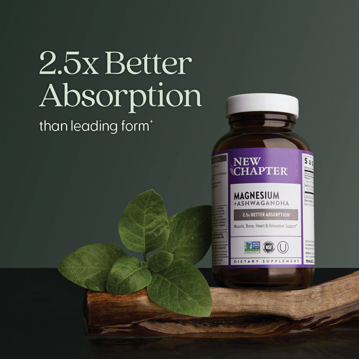A bottle of New Chapter Magnesium + Ashwagandha, Muscle, Bone, Heart, Relaxation Support with magnesium bisglycinate sits on wood by ashwagandha leaves and roots. Text: 2.5x Better Absorption than leading form.