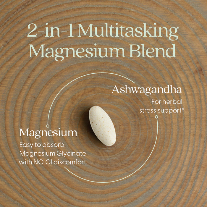 A beige supplement tablet is centered on a wooden surface. Text around it reads: New Chapter Magnesium + Ashwagandha, supporting muscle, bone, heart, and relaxation with easy-absorb magnesium bisglycinate and herbal stress support.