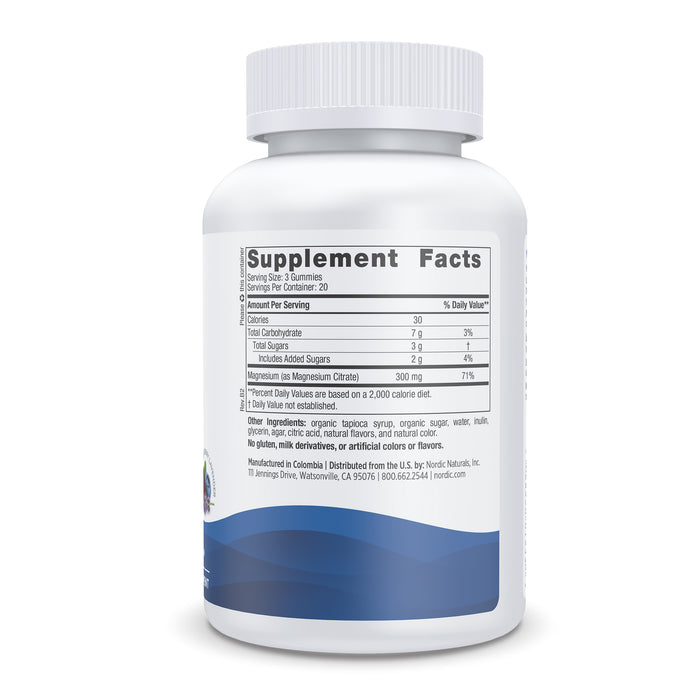 A white bottle with a blue wave design features Supplement Facts listing serving size, calories, carbs, sugars, and magnesium content. Ideal for promoting muscular relaxation, the label also includes Nordic Naturals company details and distribution info for Magnesium Gummies.