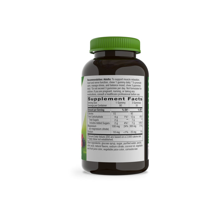 A brown bottle of Natures Way Magnesium Gummy with a green cap is shown. The white label displays supplement facts and usage instructions in black text, with the bottle turned to reveal the nutritional information panel.