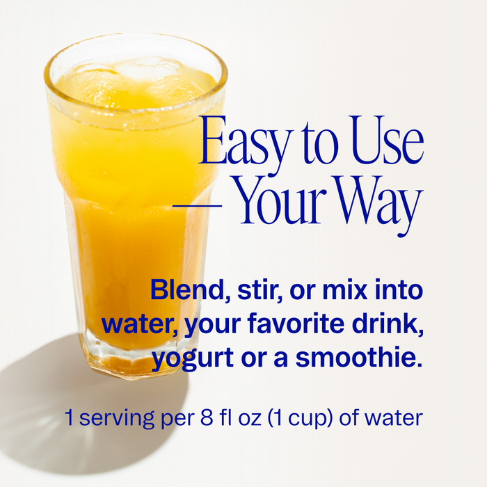 A glass of orange Magnificient: 4-in-1 Magnesium Powder by Ora Organic with ice sits on a light surface. Blue text beside it reads: Easy to Use—blend, stir, or mix into water, drinks, yogurt, or smoothies for muscle recovery and sleep support.