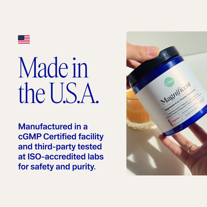 A hand holds a blue jar labeled Magnificient: 4-in-1 Magnesium Powder by Ora Organic near a glass of orange liquid. Text reads: Made in the U.S.A., crafted in a cGMP facility, and third-party tested at ISO-accredited labs for safety and purity.