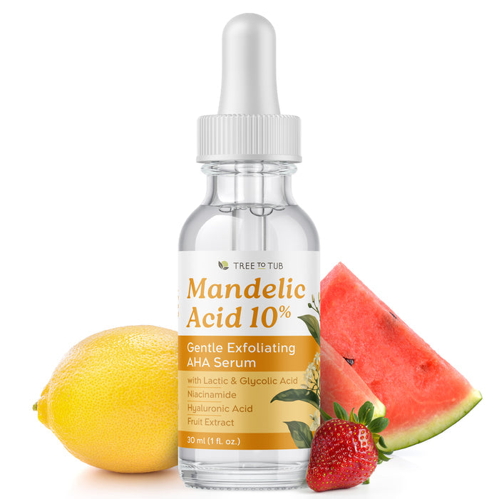 A clear dropper bottle of Tree To Tubs Mandelic Acid 10% Gentle Exfoliating AHA Serum is artfully positioned with juicy watermelon, strawberry, and lemon slices. The silver-capped design underscores its key ingredients, marking it as a standout in the AHAs skincare range.