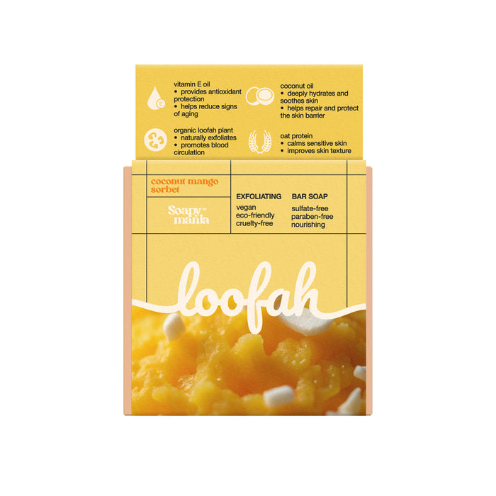 A yellow Soapymania Mango Coconut Sorbet Exfoliating Loofah Bar Soap, vegan and cruelty-free with a built-in loofah, is sulfate- and paraben-free. The packaging features images of mango pieces.