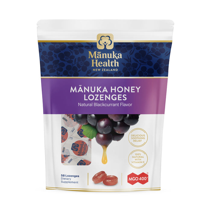 Manuka Healths Manuka Honey Lozenges, packed with Vitamin C and MGO 400+ potency, provide soothing comfort. The blue and purple package displays lozenges and blackcurrants, offering delicious relief in 58 lozenges.