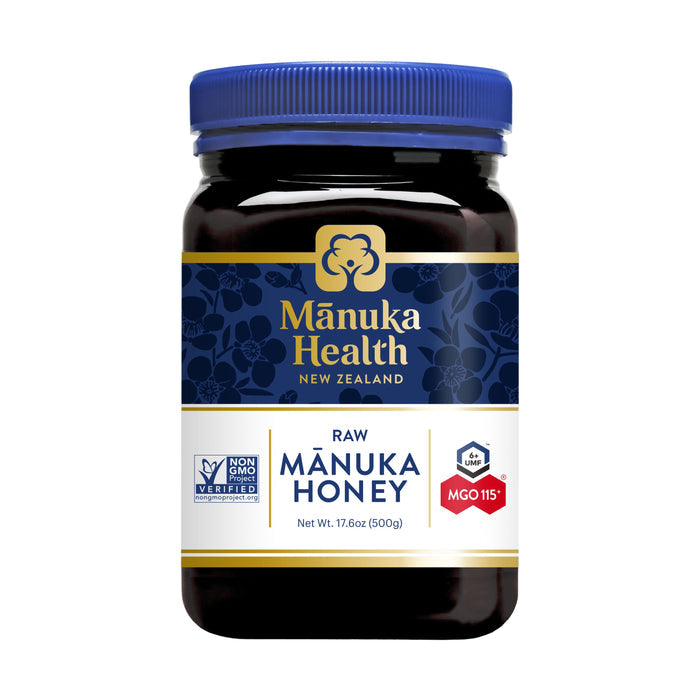 A 17.6 oz jar of Manuka Healths Raw Manuka Honey, MGO 115+/UMF 6+ from New Zealand, features a blue lid and certification logos on its label, embodying purity and quality.