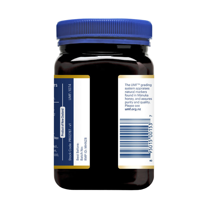 The Manuka Health jar, on a white background, has a blue lid and a white label with black/blue text showing UMF 6+ for Manuka Honey. Sourced from New Zealand and meeting MGO 115+ standards, its barcode is on the right side of the label.