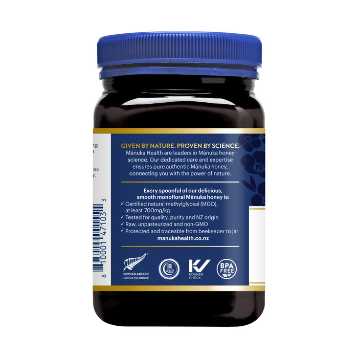 A dark jar of Manuka Health Manuka Honey with a blue lid highlights its purity and authenticity with UMF 18+ certification and MGO 700+, emphasizing a scientifically tested, GMO-free, eco-friendly product.