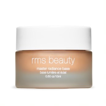 The 0.50 oz/15ml glass jar, featuring a white lid and labeled RMS Beauty, contains Master Radiance Base cream, crafted with organic ingredients for a radiant glow. It highlights effortlessly and includes product details in English and French for easy use.