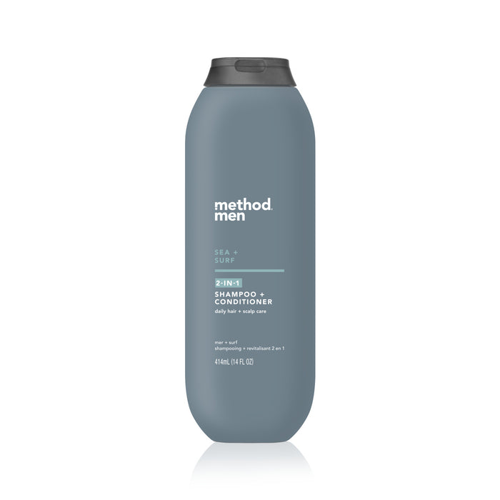 The Mens 2-in-1 Shampoo + Conditioner by method comes in a sleek blue-gray bottle with a black flip-top cap, holding 414 ml (14 fl oz). Enriched with menthol, it features text promoting daily hair and scalp care.